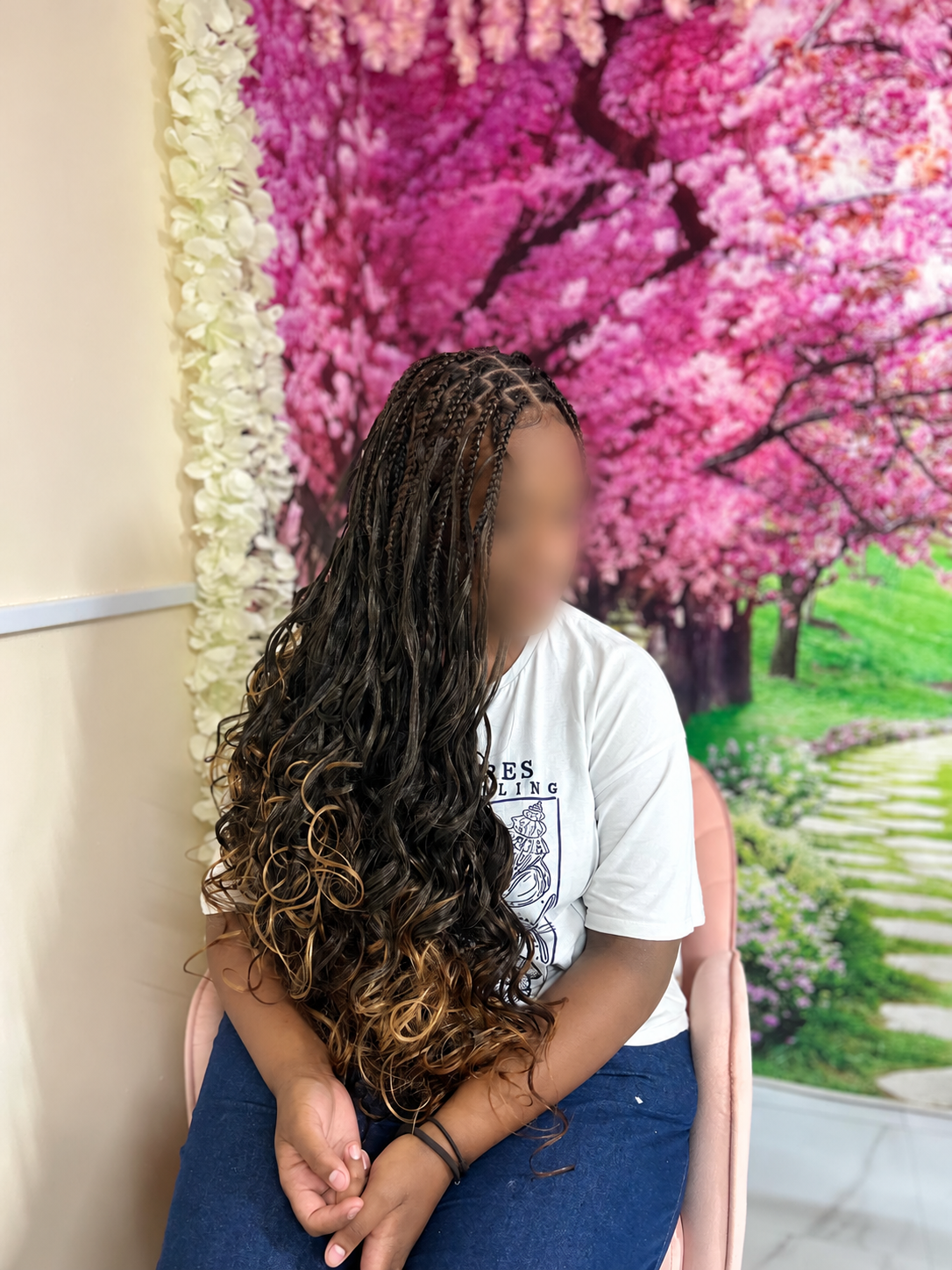 Long braids with flowing curls, client face blurred