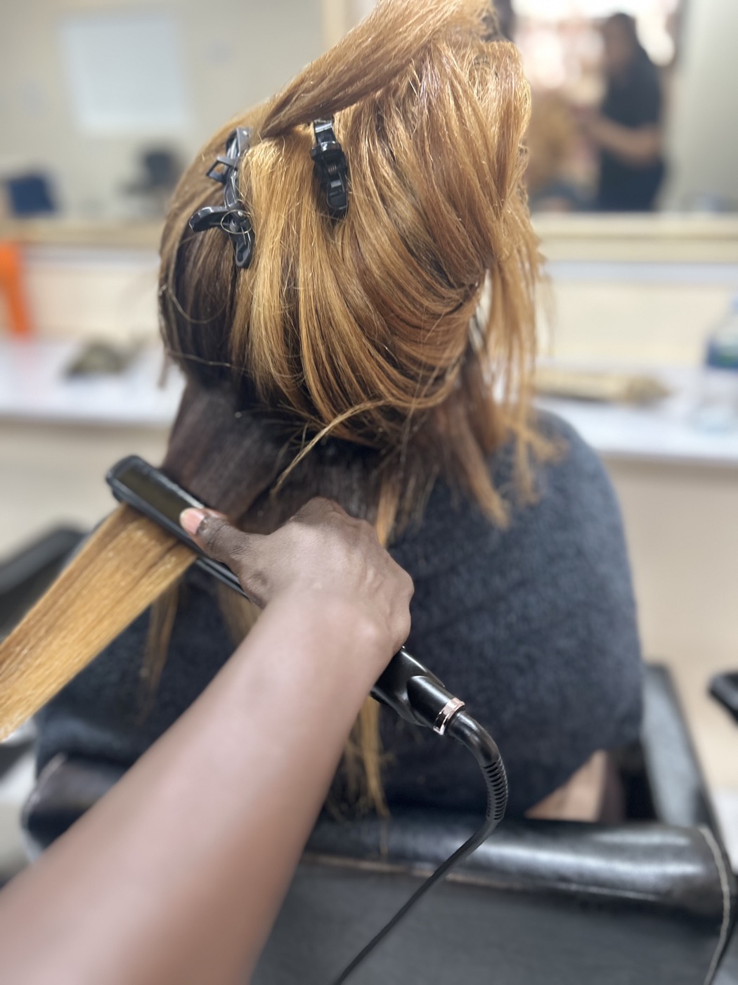 Straightening and sectioning hair in the salon